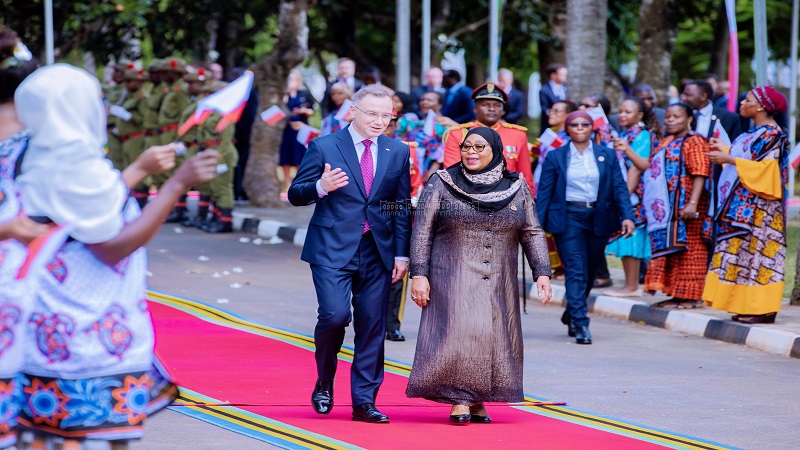 President Samia Suluhu Hassan shares a light moment with visiting Polish President Andrzej Duda shortly after the latter’s arrival at State House in Dar es Salaam 