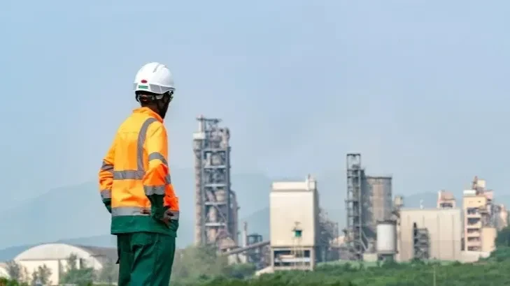 An unidentified Hima Cement worker is seen observing the Kasese plant in Uganda. 
