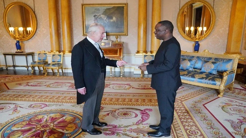 Tanzanian High Commissioner Mbelwa Kairuki presents his credentials to King Charles during a private audience at Buckingham palace