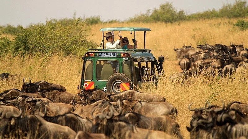 Tourists enjoying the good sceneries of Ngorongoro National Park.