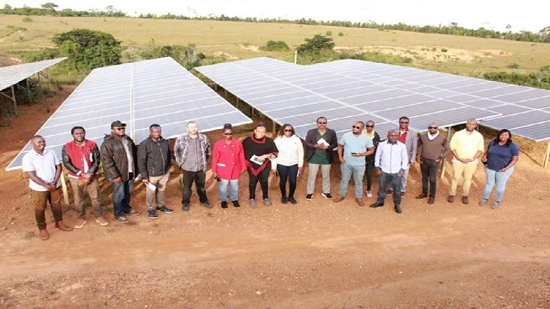 Bankers, TAREA representatives, and energy experts gather at the Kidunda Farm solar project in Iringa