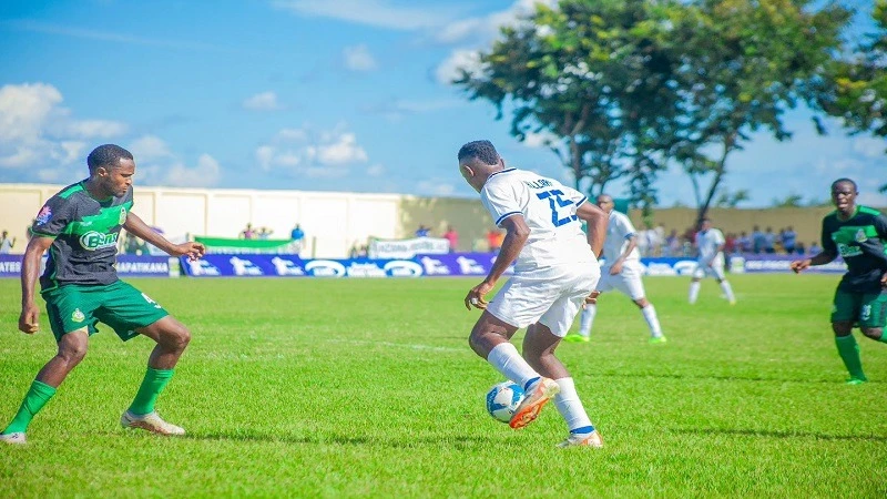 Mtibwa Sugar's fullback, Abdul Hillary, negotiates his way past Prisons' center-back, Jumanne Elfadhili, when the clubs met in a 2023/24 NBC Premier League duel played at Manungu Stadium in Morogoro on March 9.