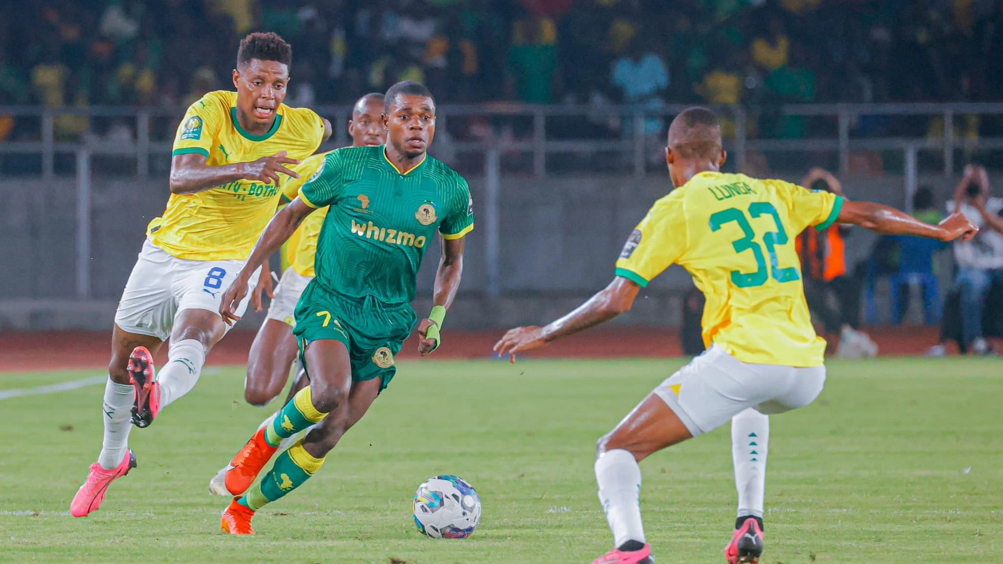 


Yanga's Maxi Nzengeli (C) negotiates his way past Mamelodi Sundowns' players when the sides took on each other in a 2023/24 CAF Champions League quarterfinal first-leg clash in Dar es Salaam on Saturday, culminating in a 0-0 draw.