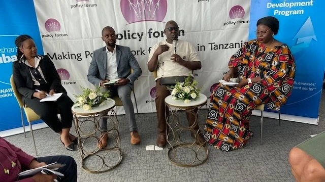  Associate Professor of Development Economics, University of Dar es Salaam, Professor Abel Kinyondo [2ndR] speaking during a Policy Forum 