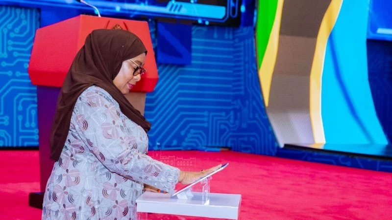 President Samia Suluhu Hassan pictured pressing an Ipad screen to mark the official launch of Personal Data Protection Commission. The event happened in Dar es Salaam today March 3, 2024.
