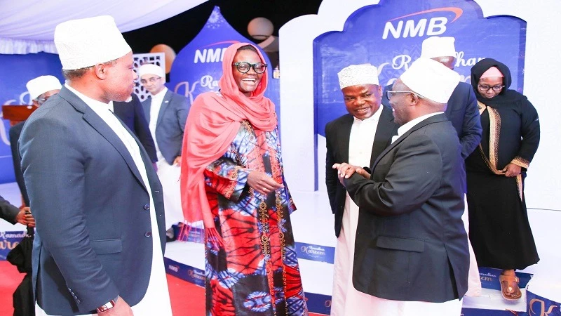 National Assembly Speaker Dr Tulia Ackson (2nd-L) shares a light moment with NMB Bank board members at iftar the bank hosted for legislators in Dodoma city at the weekend.