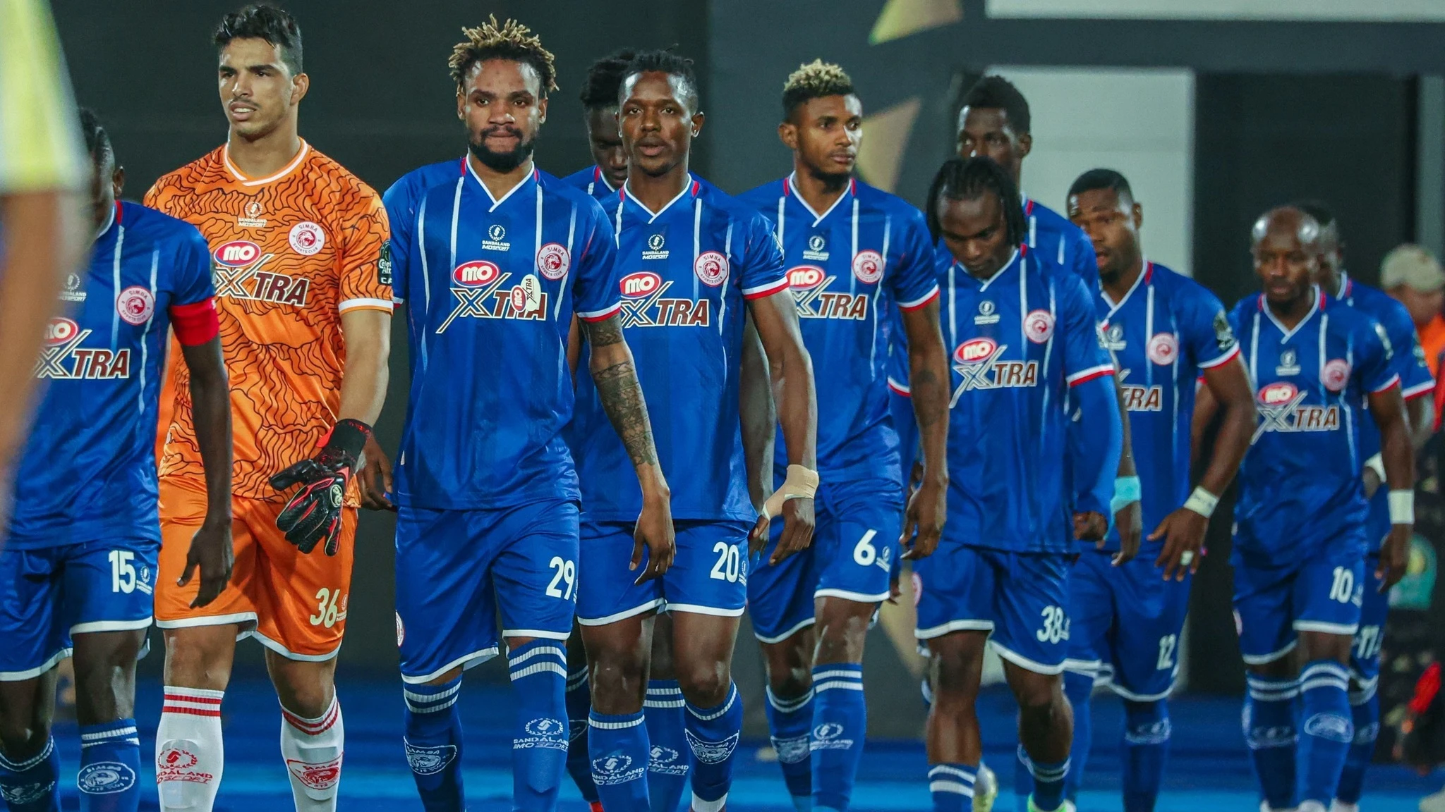 Footballers making Simba SC are pictured heading to the pitch at Cairo International Stadium in Cairo to take on Al Ahly in the 2023–24 CAF Champions League last eight's rematch last weekend.