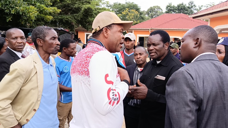 Some members of the opposition Chadema’s General Assembly in Iringa Region exchange views just outside the venue of a meeting in Iringa municipality on Thursday.