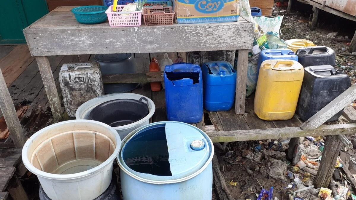 Containers kept to collect rainwater in Kuala Selat houses in Indonesia