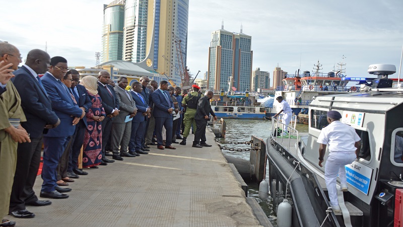 Prime Minister Kassim Majaliwa (3rd L) looks at the new patrol boat for combating illegal fishing in the sea and the great lakes shortly before launch it in Dar es Salaam over the weekend. 