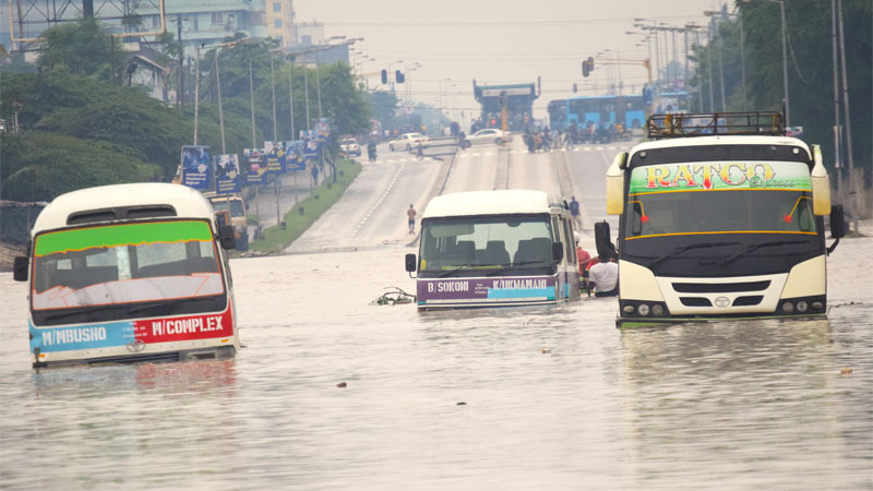 Dar es Salaam commuter buses strapped in the water floods at Jangwani area along Morogoro road following the ongoing rain yesterday.