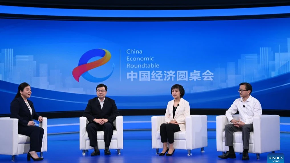 Photo shows a scene at the China Economic Roundtable in Beijing, capital of China. China Economic Roundtable is an all-media talk platform launched by Xinhua News Agency, with the first episode featuring the Chinese economy. 
