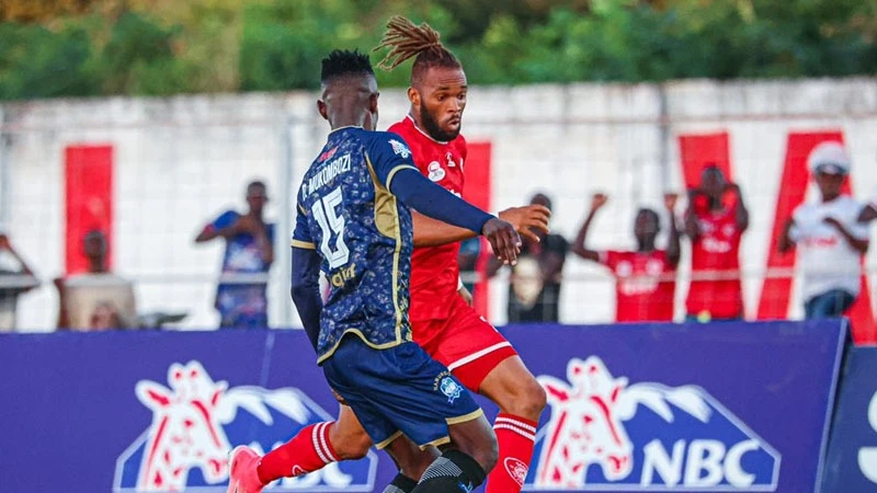 

Simba SC's winger Willy Essomba Onana (R) negotiates his way past Namungo FC's defender, Derrick Mukombozi, when the teams met in a 2023/24 NBC Premier League duel in Lindi on Tuesday and were locked to a 2-2 draw. 