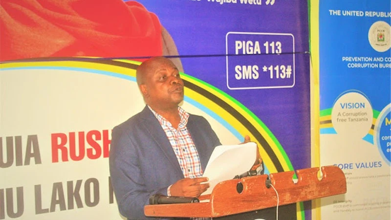 PCCB commander, Tanga region, Victor Swella reads the bureau's working report for the first quarter of this year.