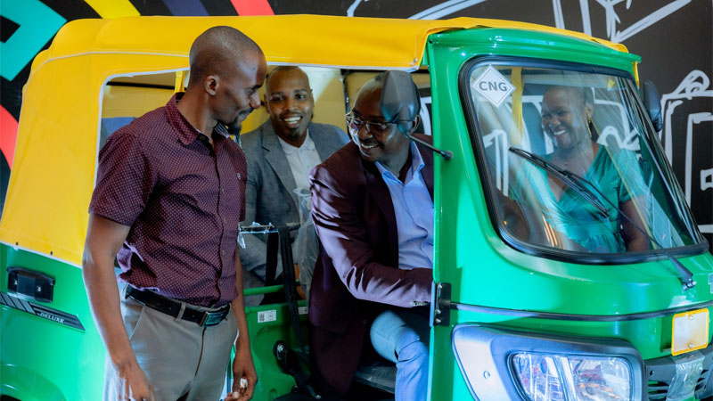 Ilala district commissioner Edward Mpogolo (in glasses) pictured in Dar es Salaam at the weekend starting a bajaj to launch an environmental conservation initiative championed by Watu Credit Tanzania Ltd 