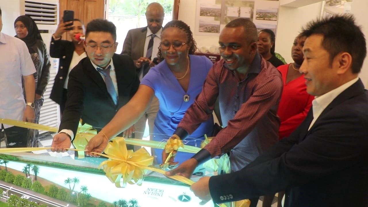 Lands, Housing and Human Settlements Development minister Jerry Slaa (2nd-R) cuts the ribbon in Dar es Salaam at the weekend to launch the city’s Sky Royal affordable housing project. 