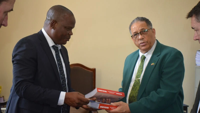 
Prof Hozen Mayaya (L), rector of the Dodoma-based Institute of Rural Development Planning, pictured in Dodoma city at the weekend gifting the US Ambassador to Tanzania, Michael Anthony Battle, Sr. (R), books published by the Dodoma-based institute
