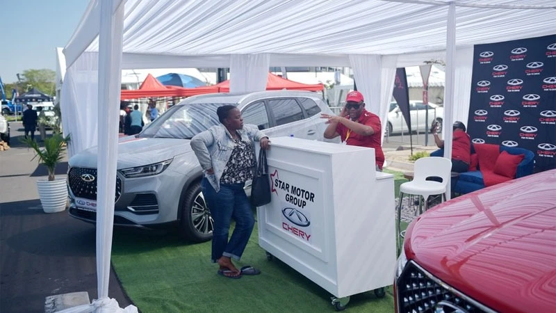 
A visitor asks about the Chery brand during the 9th edition of the Shell Gaborone Motor Show in Gaborone, Botswana.