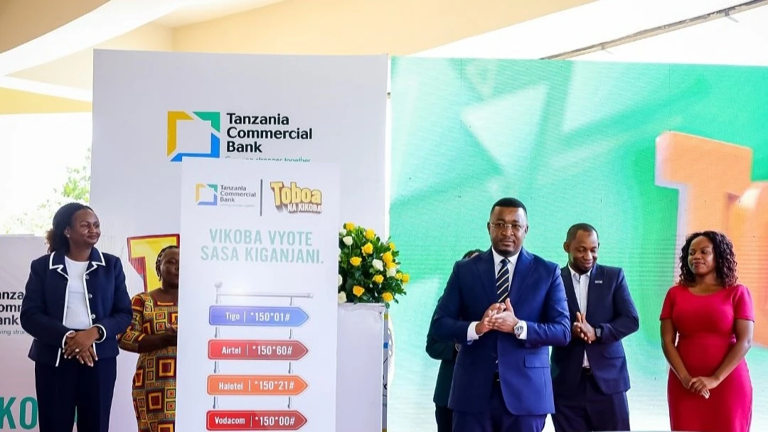 Adam Mihayo, CEO, Tanzania Commercial Bank (3rd R) poses in a photo during the launching of a Community Savings Groups Digital Platform in Dar es Salaam yesterday. Looking on are representatives from telecommunication providers.