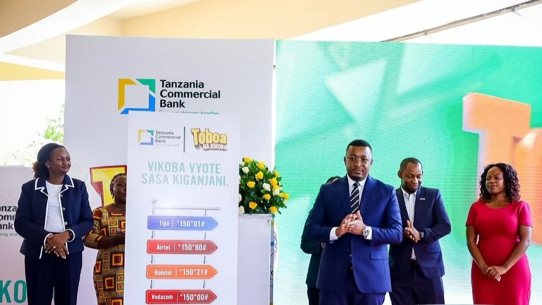 Adam Mihayo, CEO, Tanzania Commercial Bank (3rd R) poses in a photo during the launching of a Community Savings Groups Digital Platform in Dar es Salaam yesterday. Looking on are representatives from telecommunication providers. 