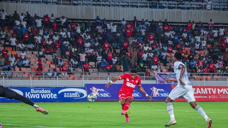 Simba SC striker David Kameta (Duchu) scores their third goal against Azam FC during their NBC Premier League match at Benjamin Stadium in Dar es Salaam on Thursday. Simba won 3-0. 