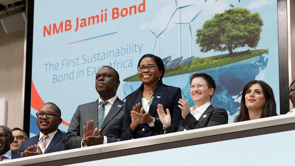 Tanzania High Commissioner to United Kingdom Mbelwa Kairuki (2nd L) and NMB Bank managing director Ruth Zaipuna (3rd L) follow the proceeding of the listing of Tanzania’s social bond at the London Stock Exchange (LSE) yesterday.