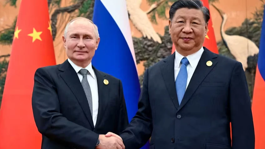 Russian President Vladimir Putin shakes hands with Chinese President Xi Jinping during a meeting at the Belt and Road Forum in Beijing, China, October 18, 2023.