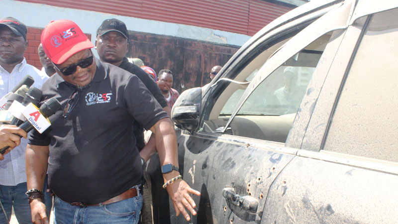 Opposition Chadema national Vice Chairman (Mainland) Tundu Lissu shows journalists and members of the party bullet holes in his car shortly after it was handed back to him at Dodoma city’s Central Police Station yesterday. 