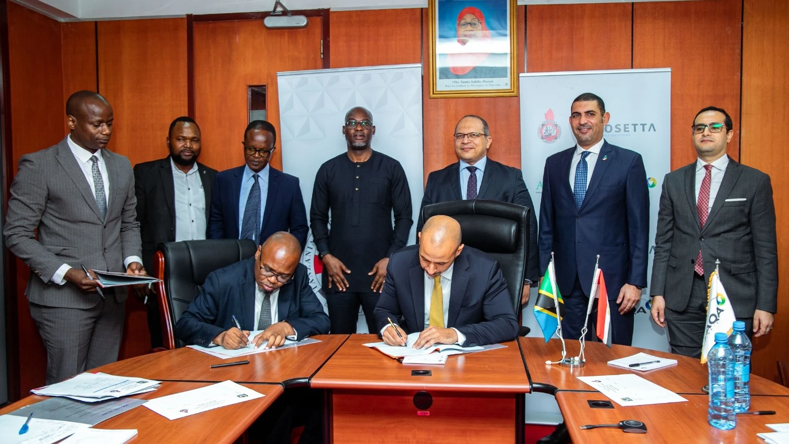 Egyptian Company Rosetta managing director Karim Shaaban (R) signs an agreement on the Mini LNG project with the Tanzania Petroleum Development Corporation (TPDF). Left (signing) is the TPDC director general, Mussa Makame. 