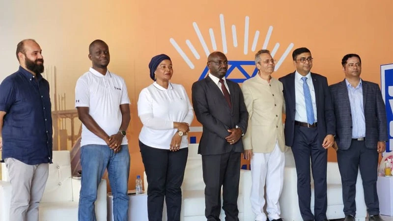 
NCBA Bank Tanzania's Godson Biyengo (2nd - L) with cement company officials at plant launch funded by the bank in Coast Region.