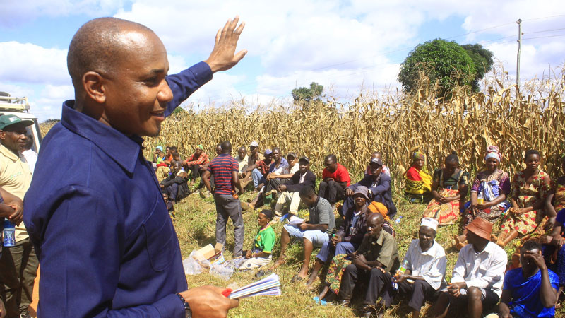 Denis Tippe, the Tanzania Agriculture Research Institute (TARI) director for Uyole-Mbeya centre, instructs farmers on improved cultivation of maize at a field class yesterday. 