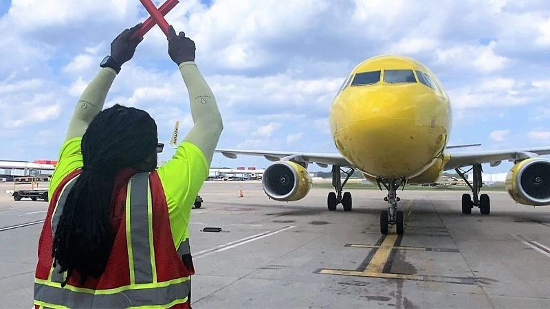 
A dedicated ground crew member ensuring smooth aircraft operations on the airport ramp