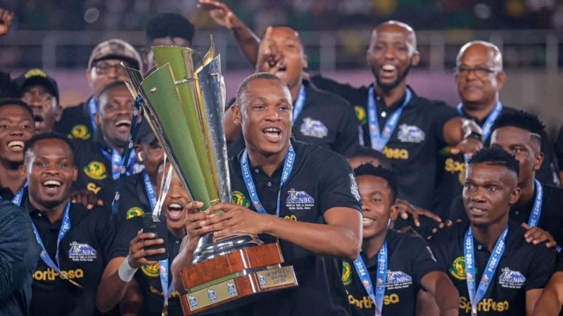 
Young Africans skipper Bakari Mwamnyeto holds the trophy after the Jangwani Street-based side were crowned the 2023/24 Premier League champions on May 25, 2024, at the Benjamin Mkapa Stadium in Dar es Salaam.