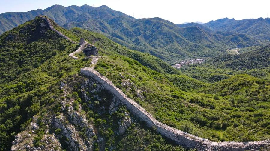 An aerial drone photo taken on June 1, 2024 shows the Great Wall and the Shixia Village in Yanqing District of Beijing, capital of China.