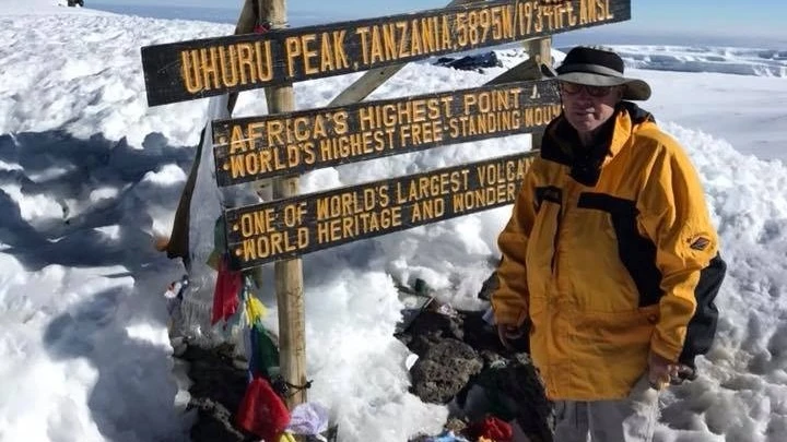 Macon Dunnagan at the highest peak of Mount Kilimanjaro.