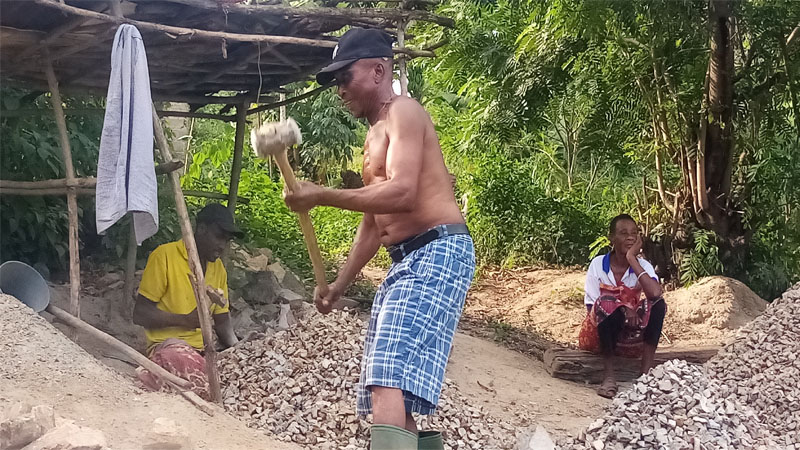 Fred Mango of Mikwamba village in Muheza District goes about his routine work of crushing stones to get pebbles for sale, as found at the weekend. 