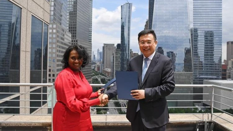 President of Xinhua News Agency Fu Hua and Daisy Veerasingham, president and CEO of the Associated Press (AP), exchange signed copy of cooperation agreement in New York, the United States, June 12, 2024.