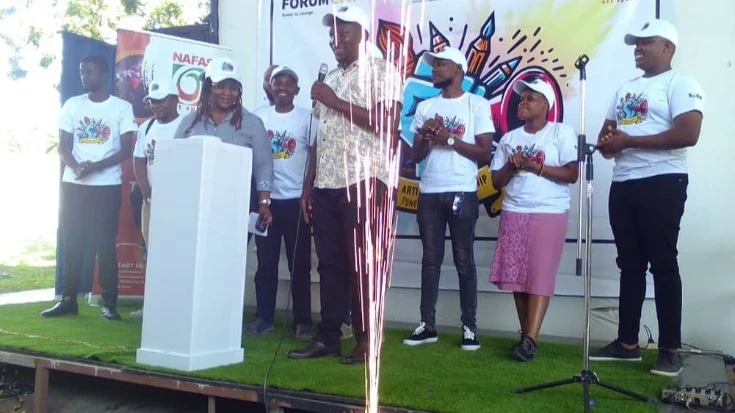 Jackson Obare, Regional Manager for the ForumCiv organization (4th R), presides over the launch of the 2024 'Artivism' Fellowship at Nafasi Art Space in Dar es Salaam on Tuesday.