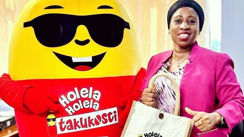 Health Minister Ummy Mwalimu receives assorted gifts from KIDO, the Ambassador of ‘Holela-Holela Itakukosti’ (Recklessness Will Cost You) campaign in Dodoma.