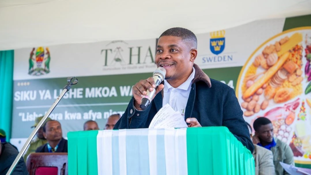 TAHA’s Chief Development Manager, Mr Anthony Chamanga, addressing the crowd yesterday during the official opening of the Nutrition Day held in Mbulu District, Manyara Region