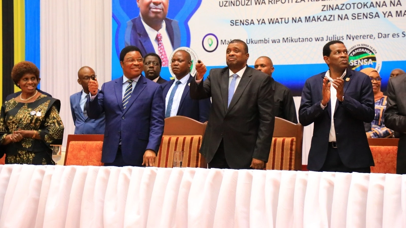 Prime Minister Kassim Majaliwa and Zanzibar Second Vice President Hemed Suleiman Abdullah (2nd-R) pictured in Dar es Salaam on Saturday pressing remote controls to launch the 2022 Demographic, Social, Economic and Environment Reports.