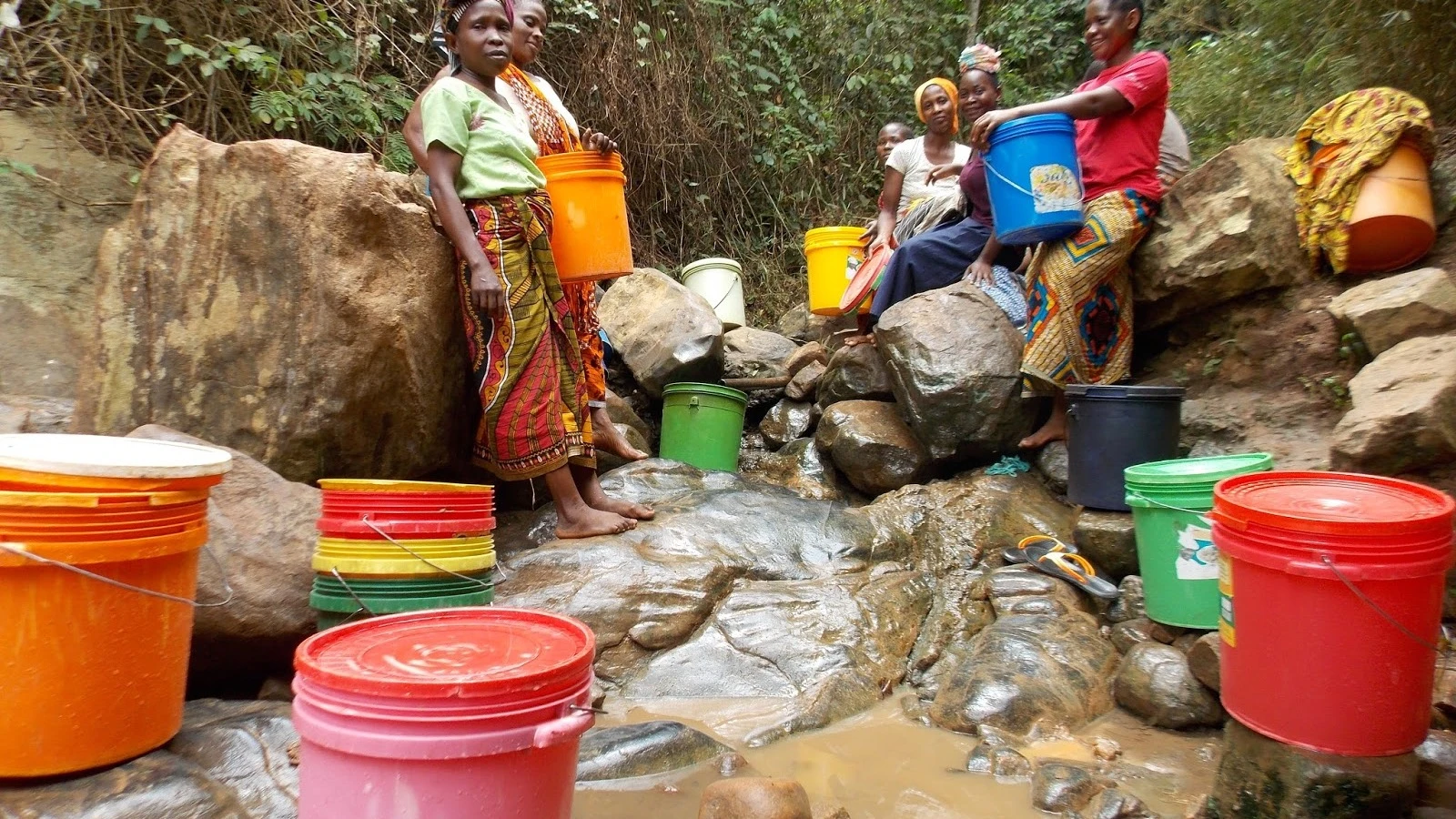 Women camped for stream water in the outskirts of Dar es Salaam. 
