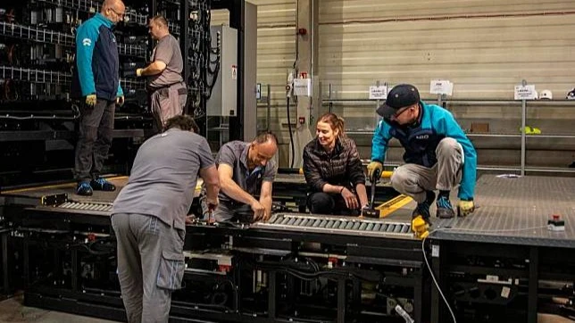 Staff members work at the NIO Power Europe Plant in Biatorbagy, Hungary, March 18, 2024.