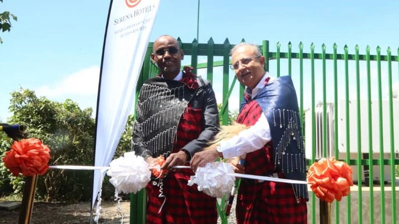 Elirehema Doriye, NCAA Acting Conservation Commissioner (left) shares a word with Ashish Sharma, CEO Ngorongoro Serena Hotels at the launch of an electricity substation. Looking on is Mbanot Tipilit, Legwainani of the Ngorongoro Maasai community.