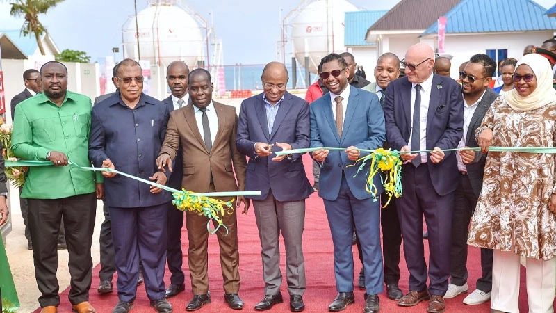Zanzibar President Dr Hussein Ali Mwinyi cuts a ribbon to launch a Oryx Gas first liquefied petroleum gas (LPG) terminal at Mangapwani area in North Unguja Region, Zanzibar yesterday. 