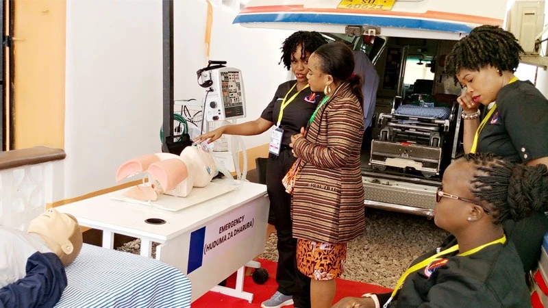 Dr Lisa Rusibamayila (gesturing) from Muhimbili National Hospital briefs a visitor at the hospital’s pavilion at the ongoing 48th edition of the Dar es Salaam International Trade Fair yesterday. 