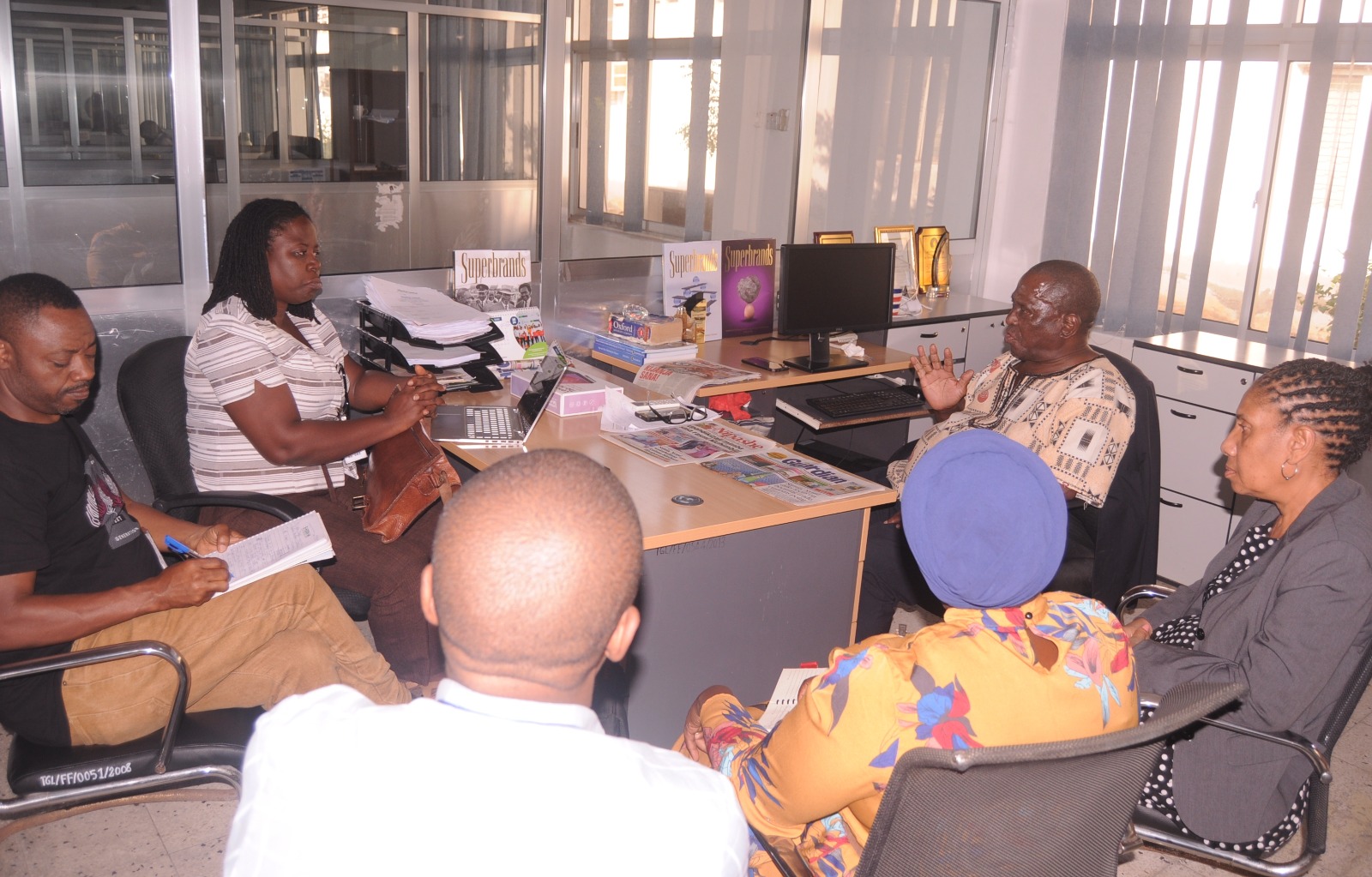 The Guardian newspaper managing editor Wallace Mauggo (gesturing) and his counterpart with the paper’s Kiswahili sister publication, Nipashe, Beatrice Bandawe (R),hold talks at The Guardian Limited offices in Dar es Salaam yesterday with Media Consultants