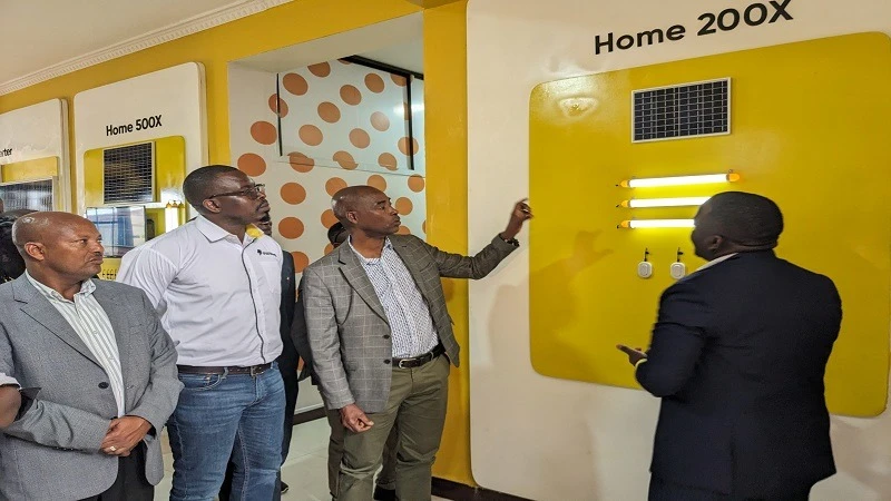 Arusha City Mayor Maximilian Iranghe (L ) switches on solar inverter installed  at the  Themi Health Centre in Arusha over the weekend.

 