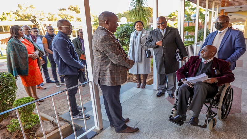 Daniel Eliufoo (C, in checkered jacket), Regional Assistant Secretary of the Commonwealth Parliamentary Associations (Africa Region) Secretariat leads a delegation out to pay a courtesy call to the Speaker of Botswana’s National Assembly, Phandu Skelemani