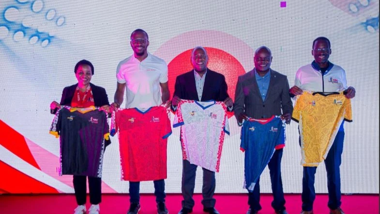 
Stakeholders of the fifth season of the Dodoma Marathon, including Theobald Sabi (in the middle), Julius Magabe (2nd R), Henry Esiaba (2nd L), Waziri Barnabas (R), and the chairman of the organizing committee, Tasiana Masimba (L), showcasing jerseys